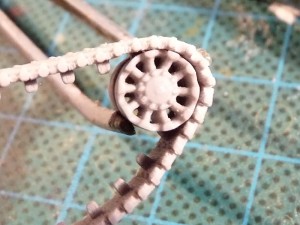 A bent track segment wrapped around an idler A bent track segment wrapped around an idler
